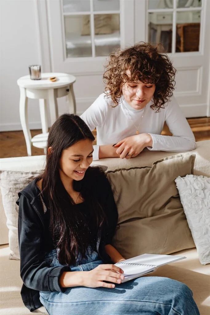 A keyworker sitting with a young person during a one to one session